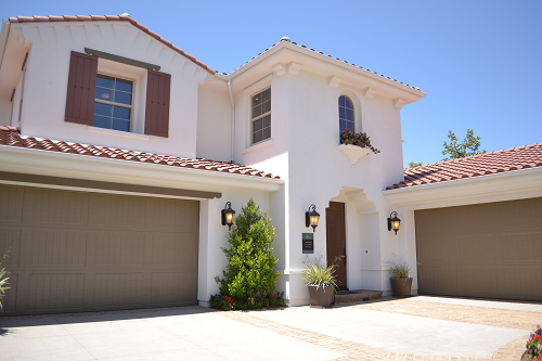 spanish style home with two garages